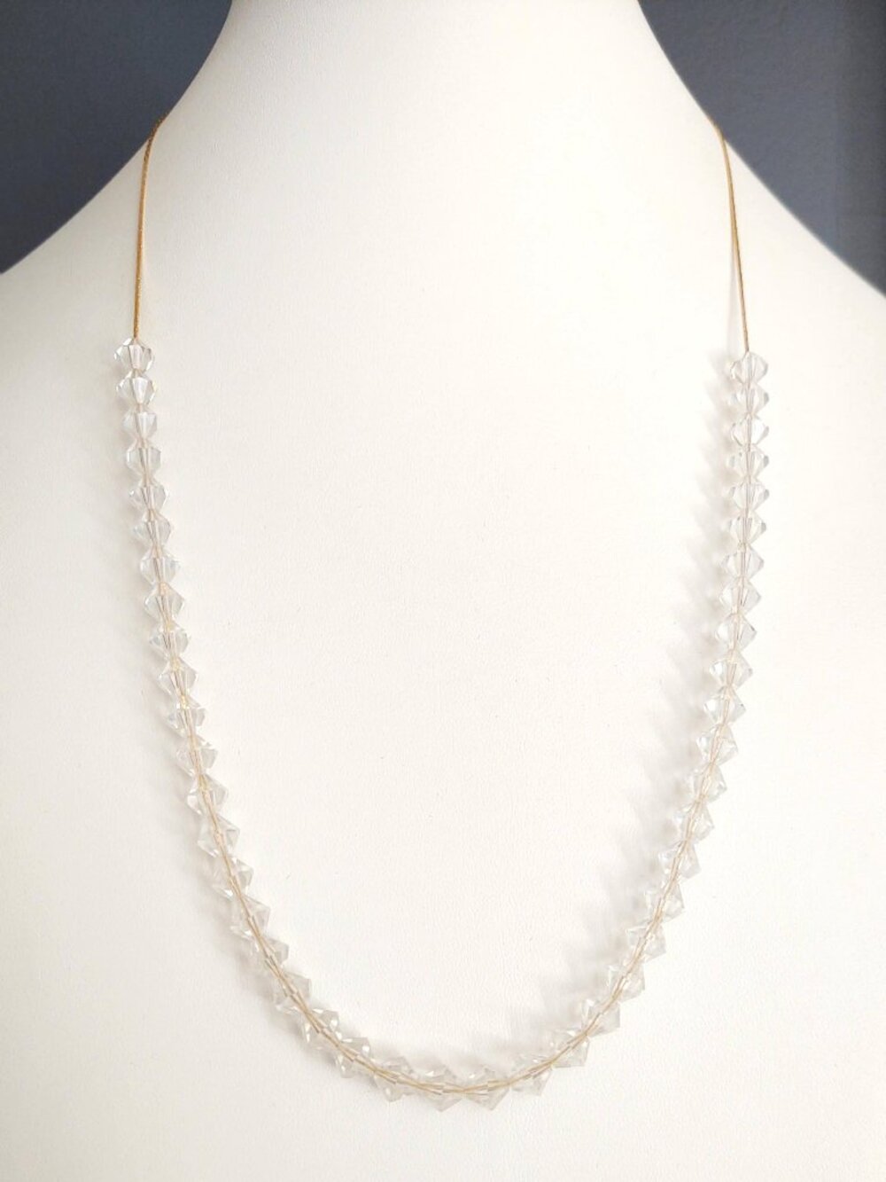 Delicate gold chain necklace with faceted crystal beads